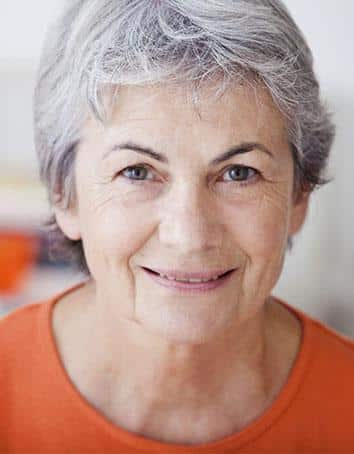 Female Senior In Orange Shirt Clinical Trial Participant