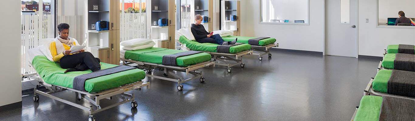Paid Clinical Trial Participants laying on beds during a trial at Biotrial