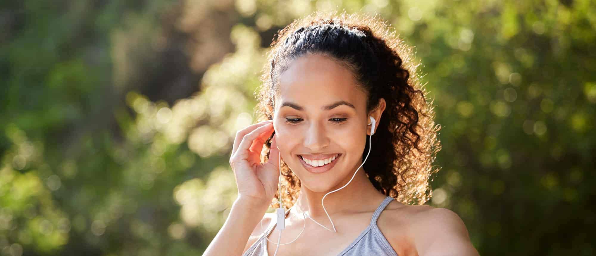 Woman paid clinical trial participant listening to music.