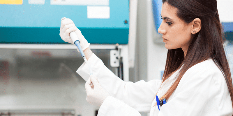 Clinical trial researcher doing tests.