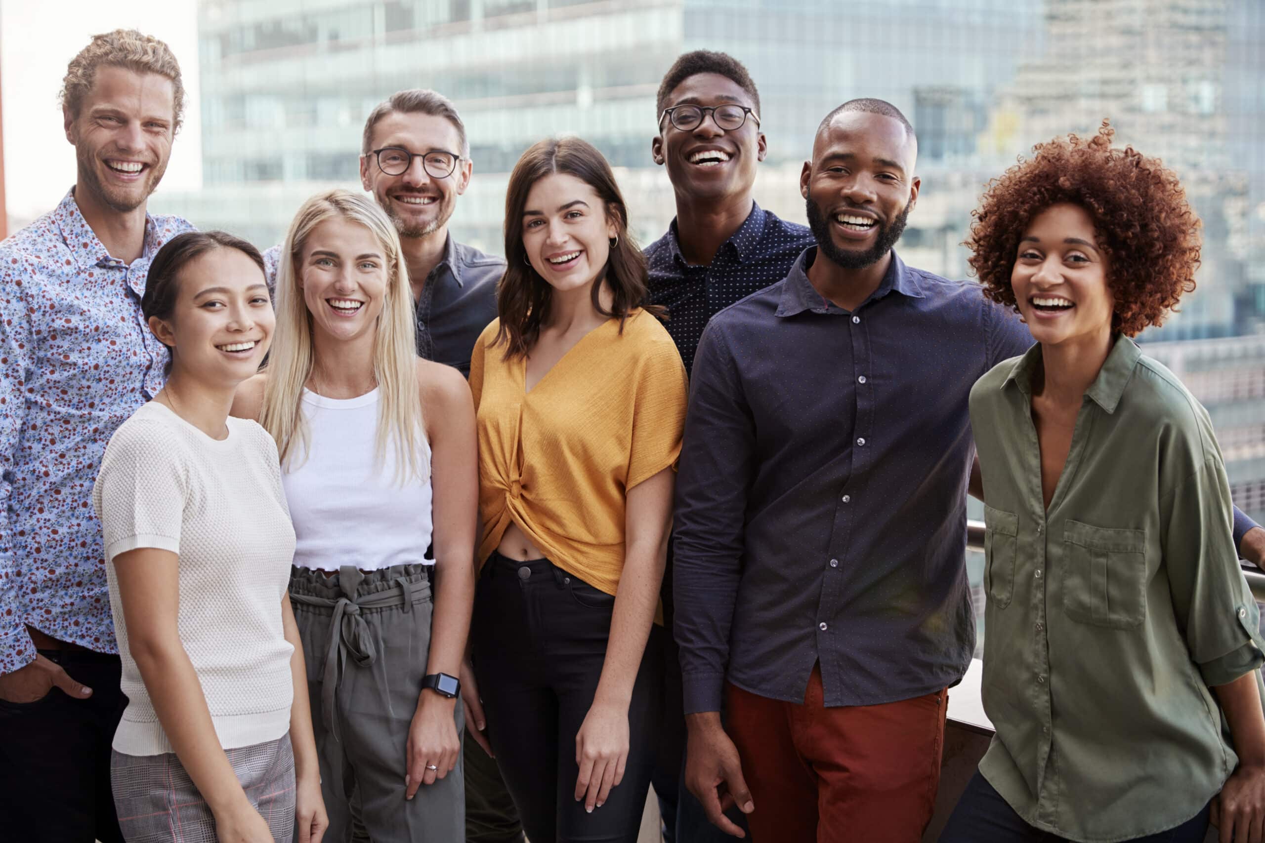 Group portrait of paid clinical trial participants standing outside.