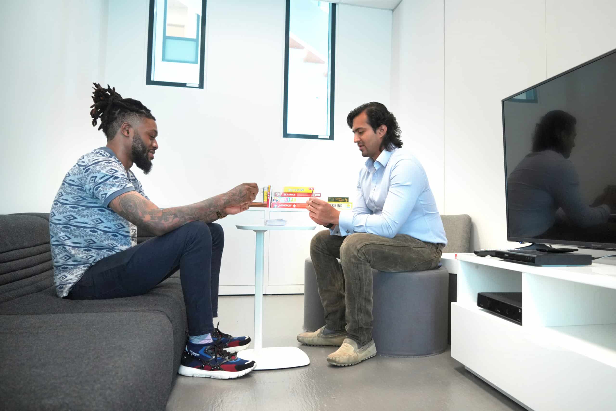 Paid clinical trial participants playing cards.