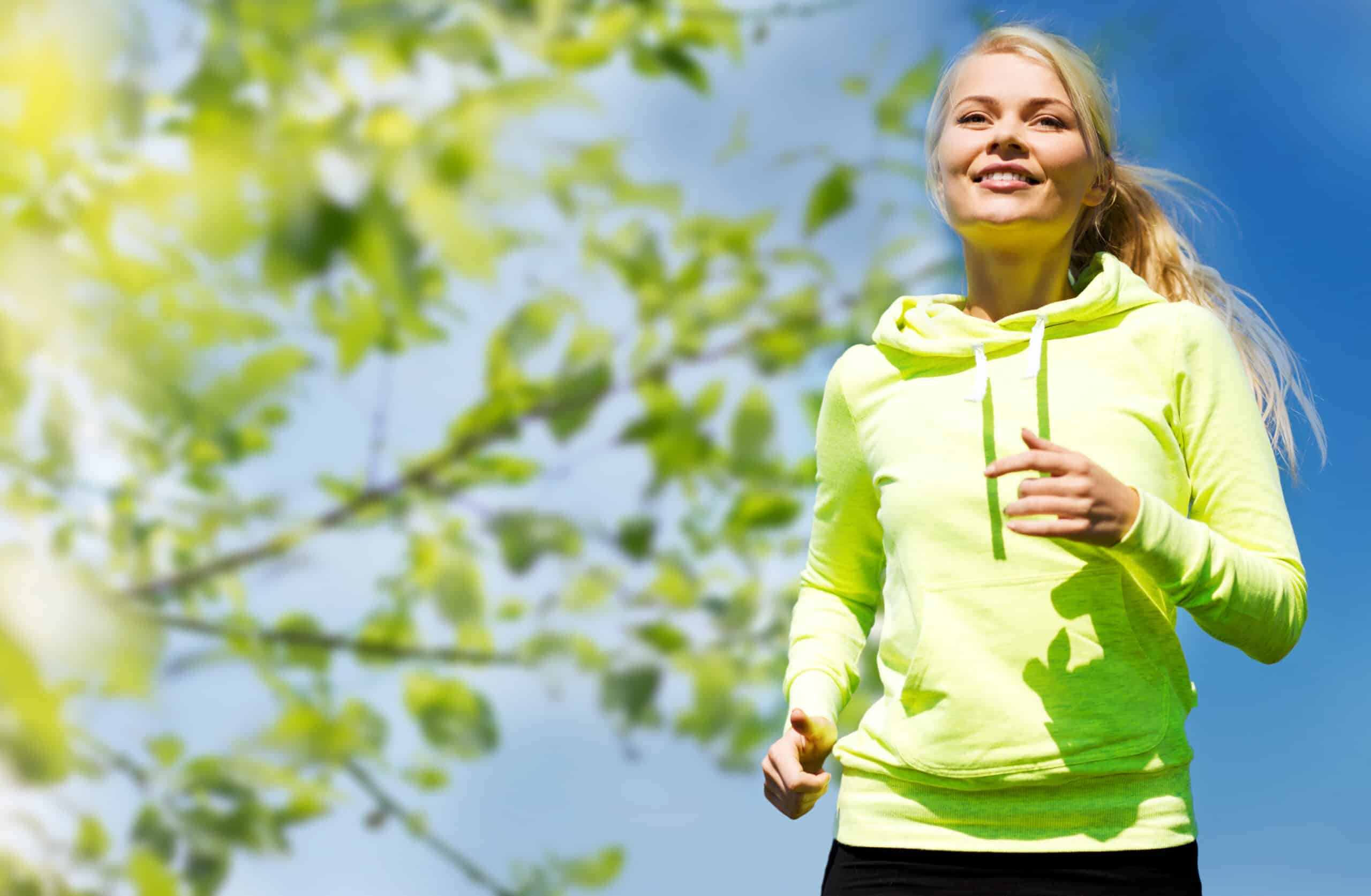 Female paid clinical trial participant jogging.