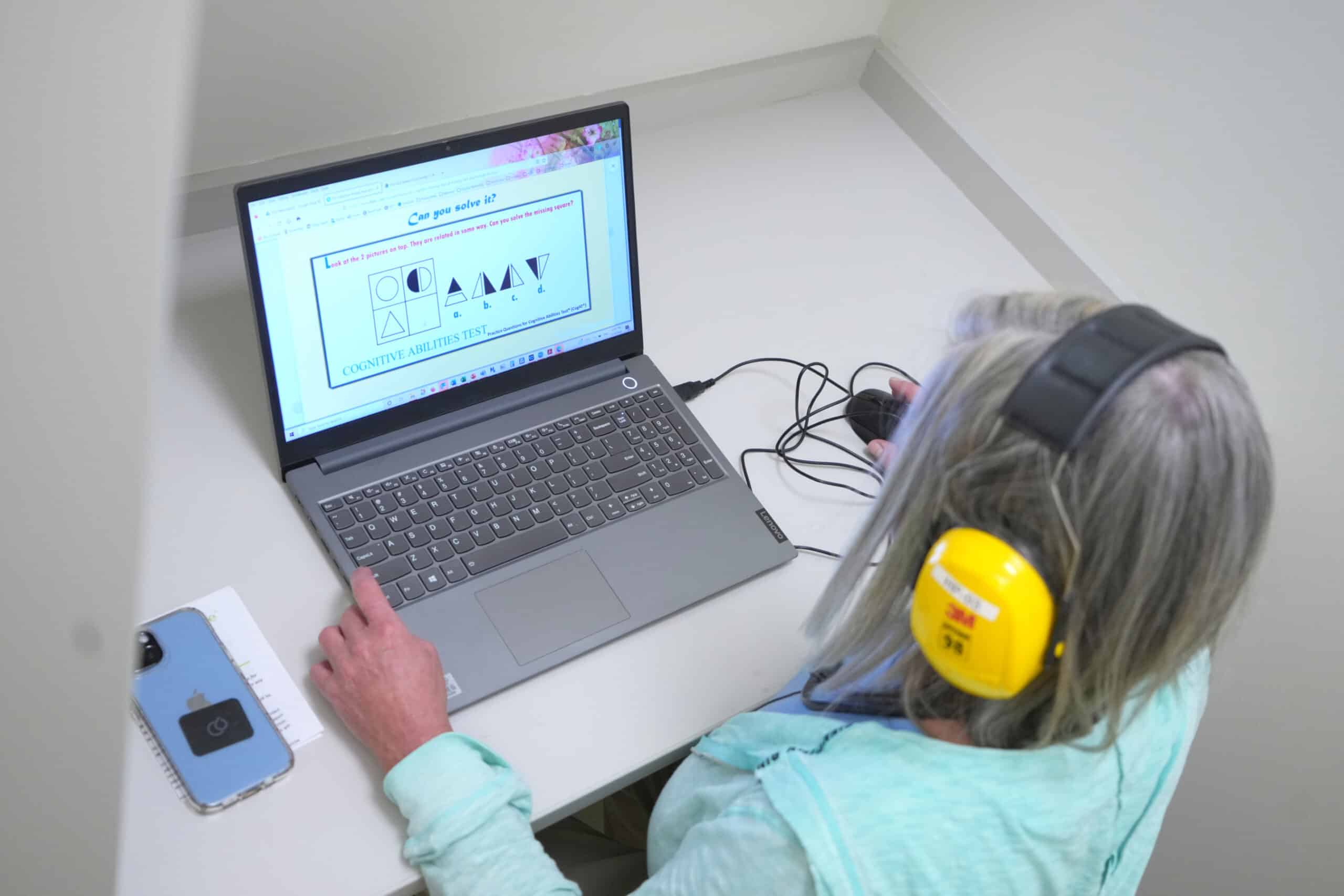 Clinical trial participant taking the cognitive abilities test.