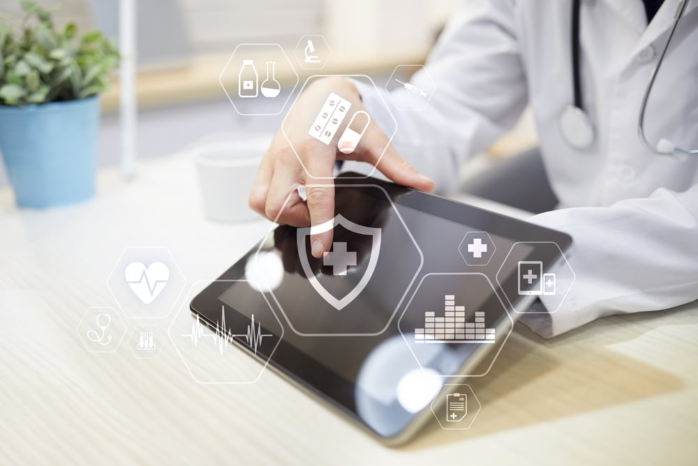 Clinical trial researcher holding a tablet.
