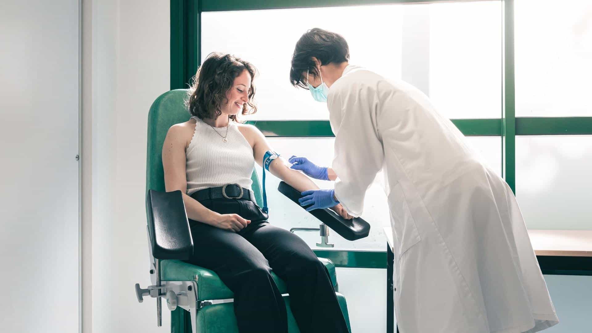 Taking of a blood sample during a clinical trial.